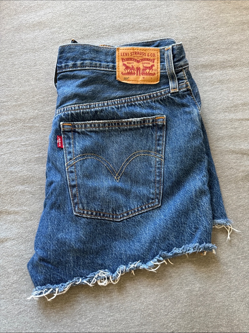 Levi's Denim Cutoff Shorts in Distressed Blue